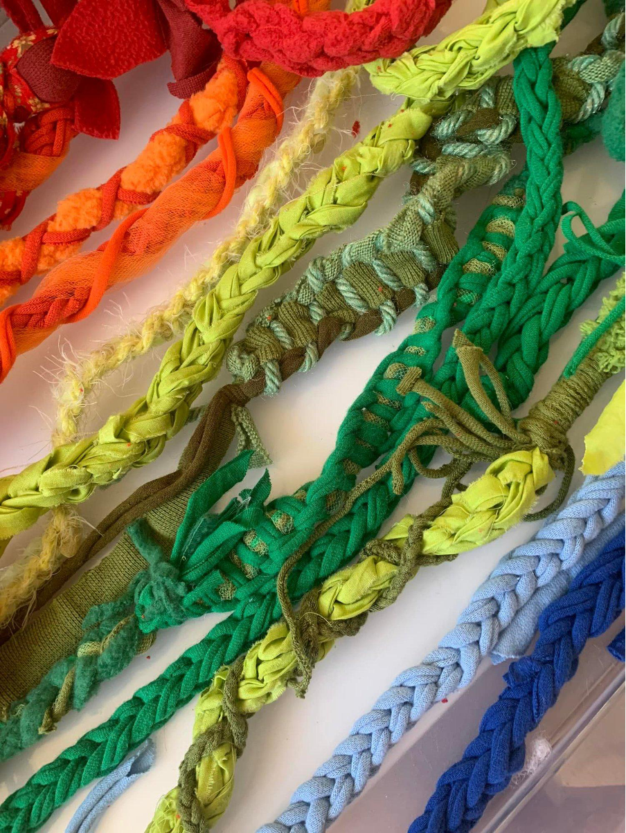 Photo of colourful twisted, braided and knotted strings.