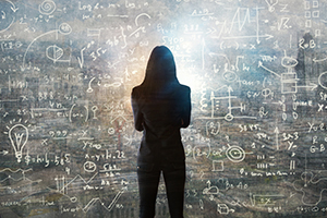 Image of person standing in front of composite image of math equations