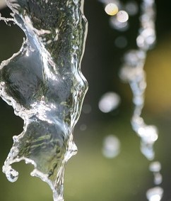 A photograph of water flowing downwards.