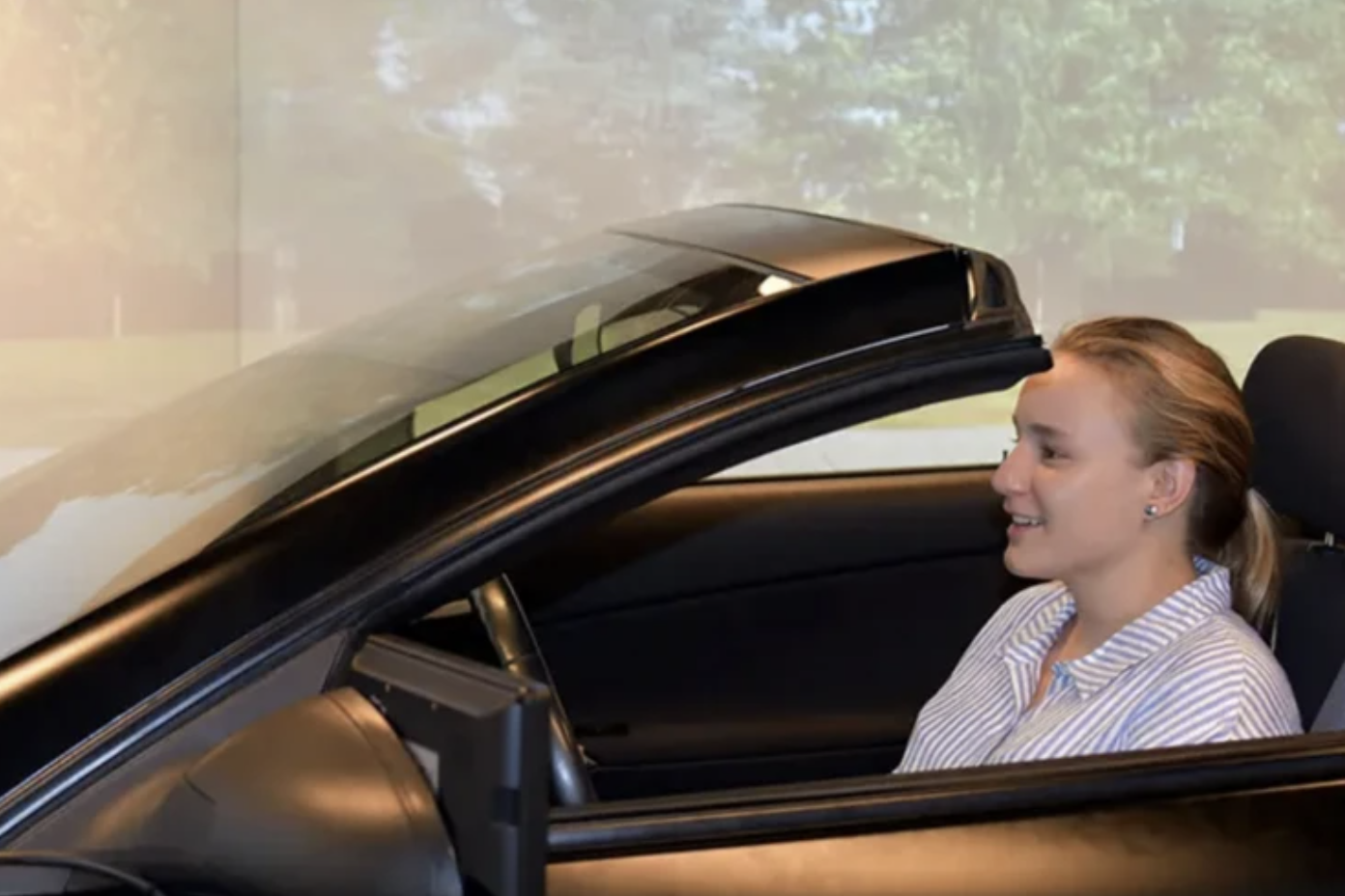 Image of Erika in vehicle in DRiVE lab